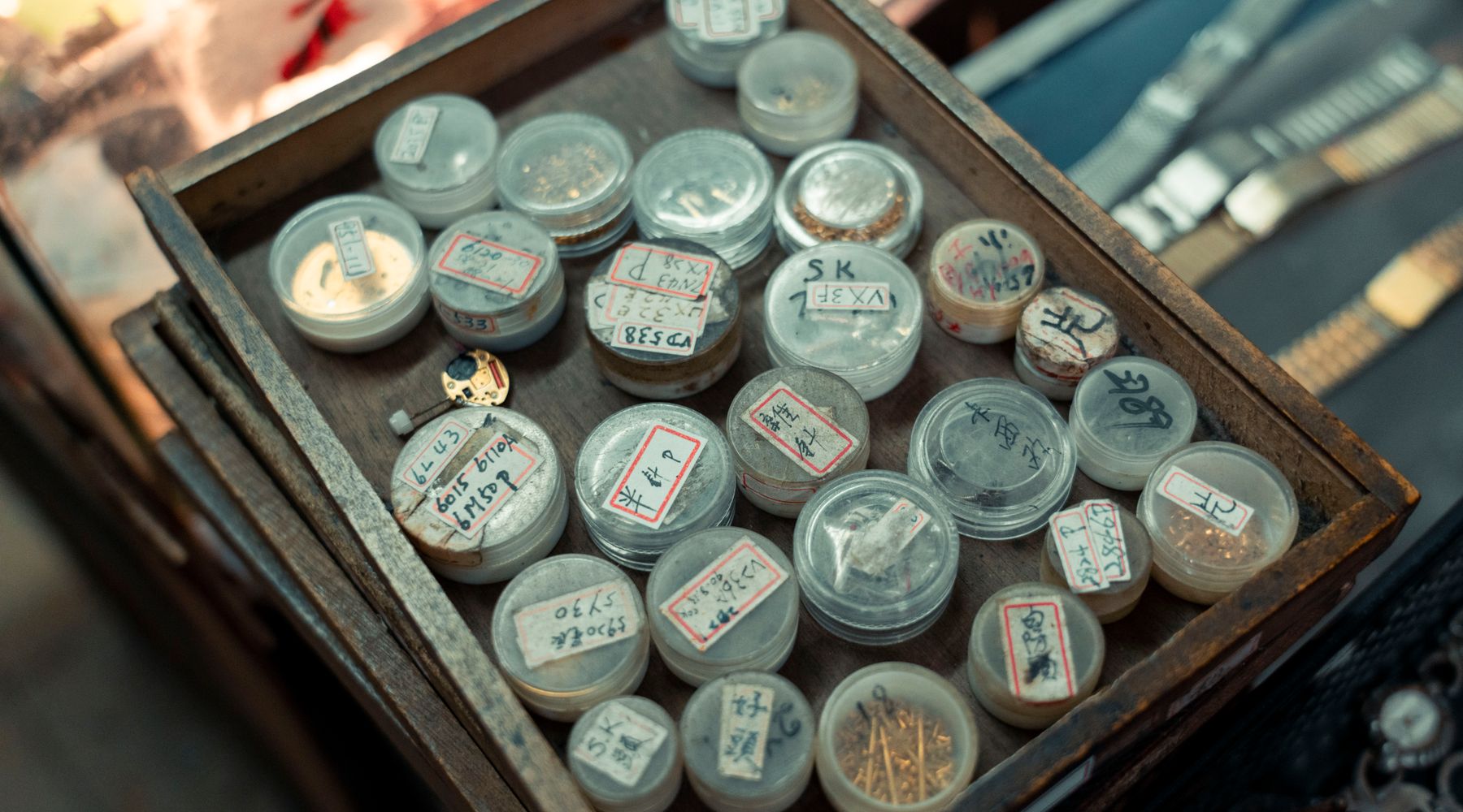 Watchmaking tools laid out on a bench